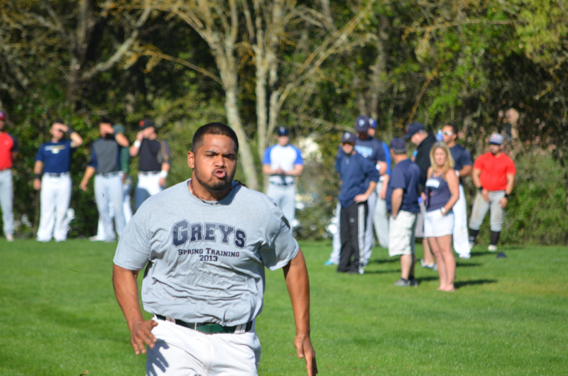 At the Pacific Association tryout in March, Daniel Baptista runs a speedy 60-yard dash, unseen by Theo Fightmaster and San Rafael Pacifics GM Mike Shapiro in the blurry background.